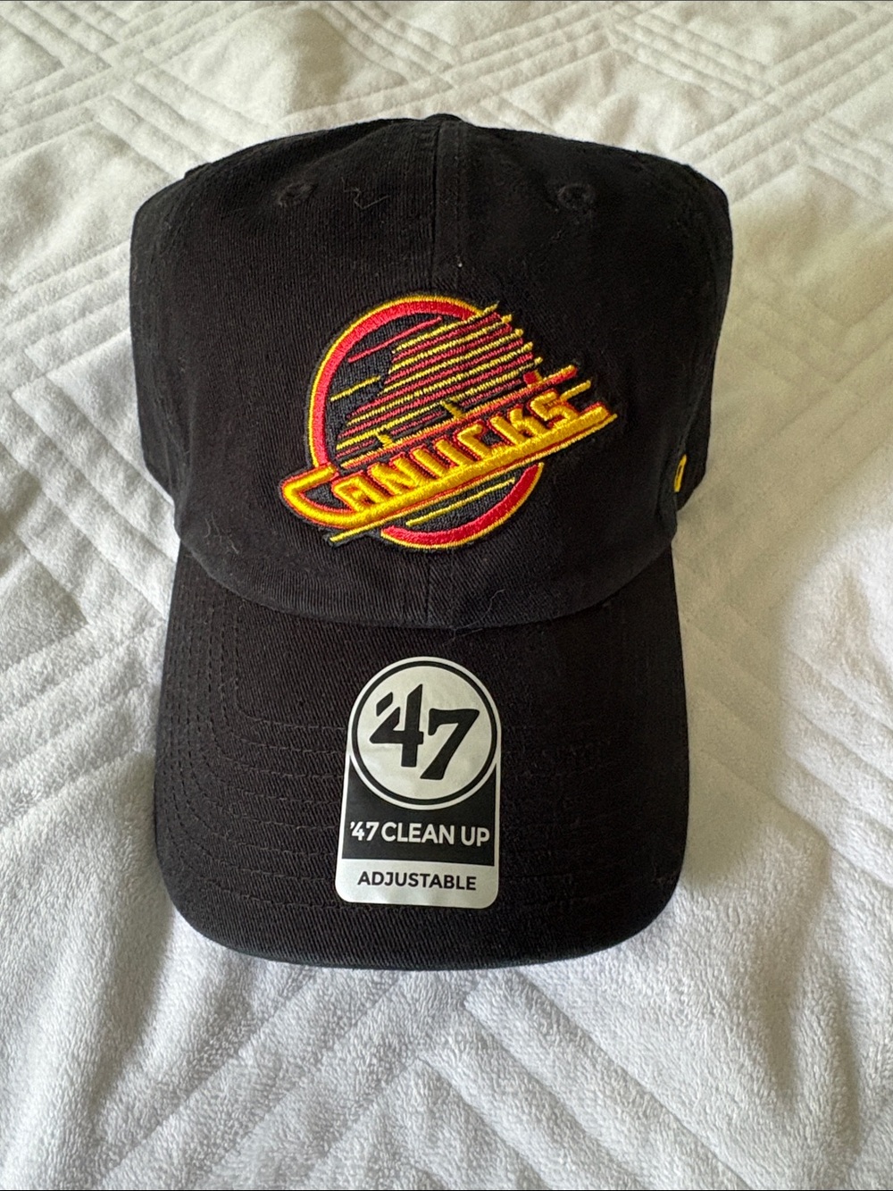 47 Vancouver Canucks Black Hat with Red and Yellow Logo